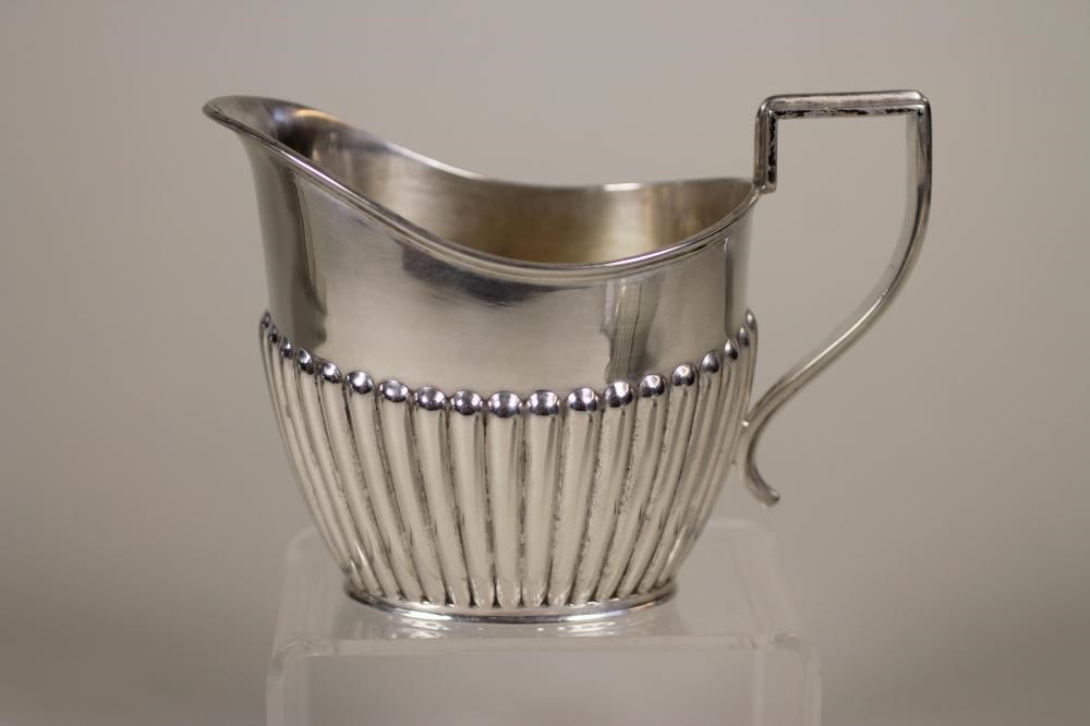 A SILVER THREE PIECE TEA SERVICE Image