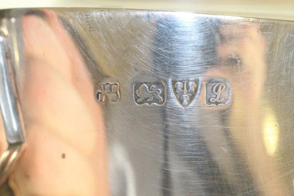 A SILVER THREE PIECE TEA SERVICE Image