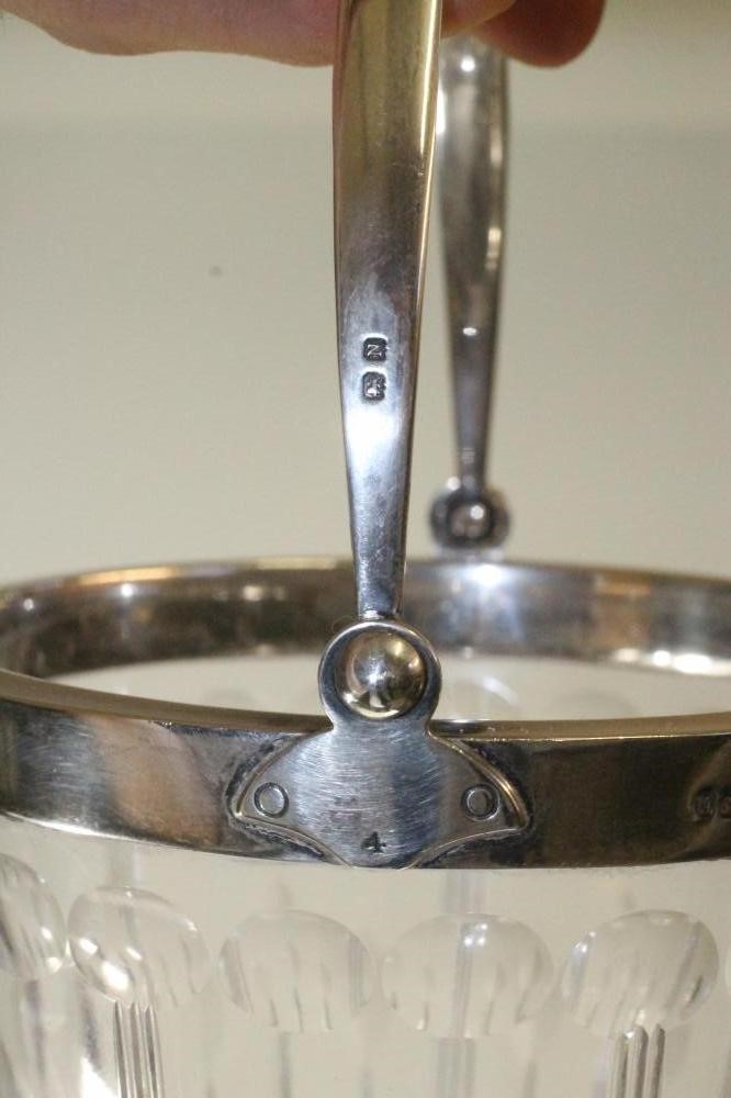 A SILVER MOUNTED GLASS ICE BUCKET Image