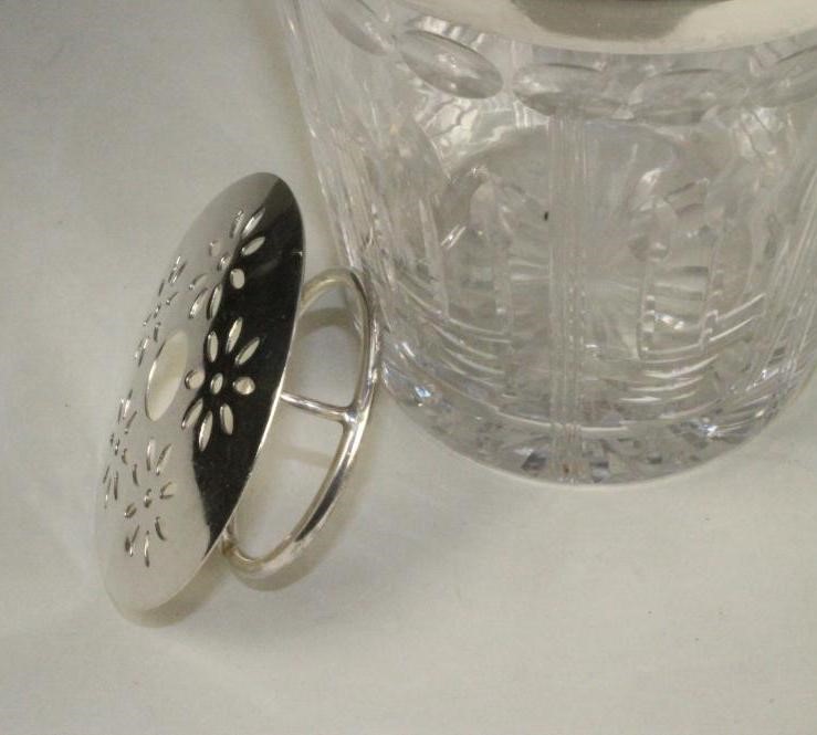 A SILVER MOUNTED GLASS ICE BUCKET Image