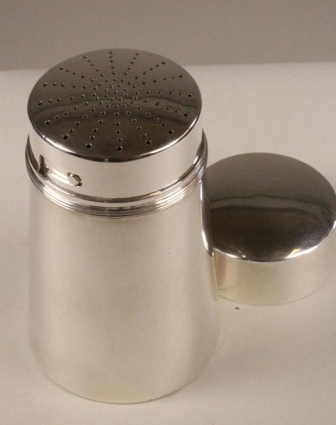 AN ART DECO SILVER CASTOR Image