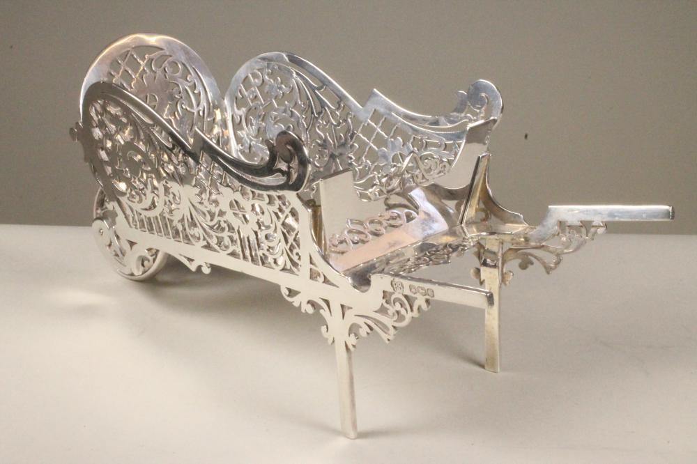 A NOVELTY SILVER SWEETMEAT HOLDER Image