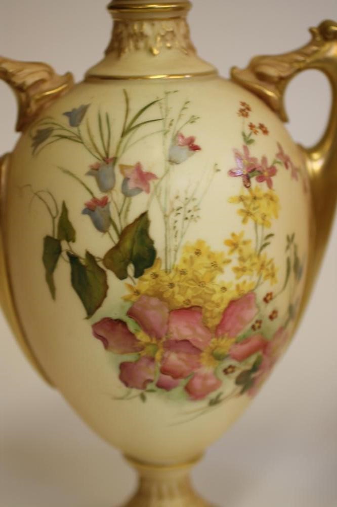A PAIR OF ROYAL WORCESTER CHINA VASES AND COVERS Image