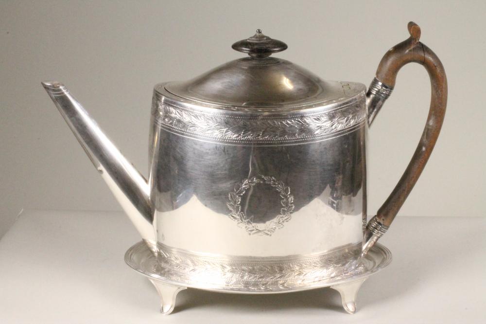 A LATE GEORGE III SILVER TEAPOT AND MATCHING STAND Image