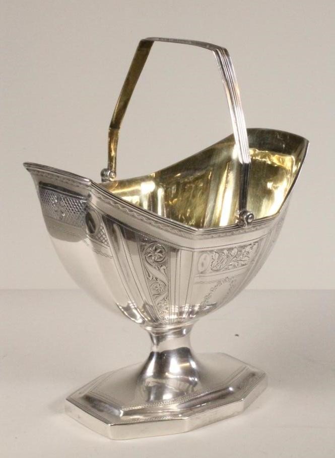 A LATE GEORGE III SILVER SUGAR BASKET Image