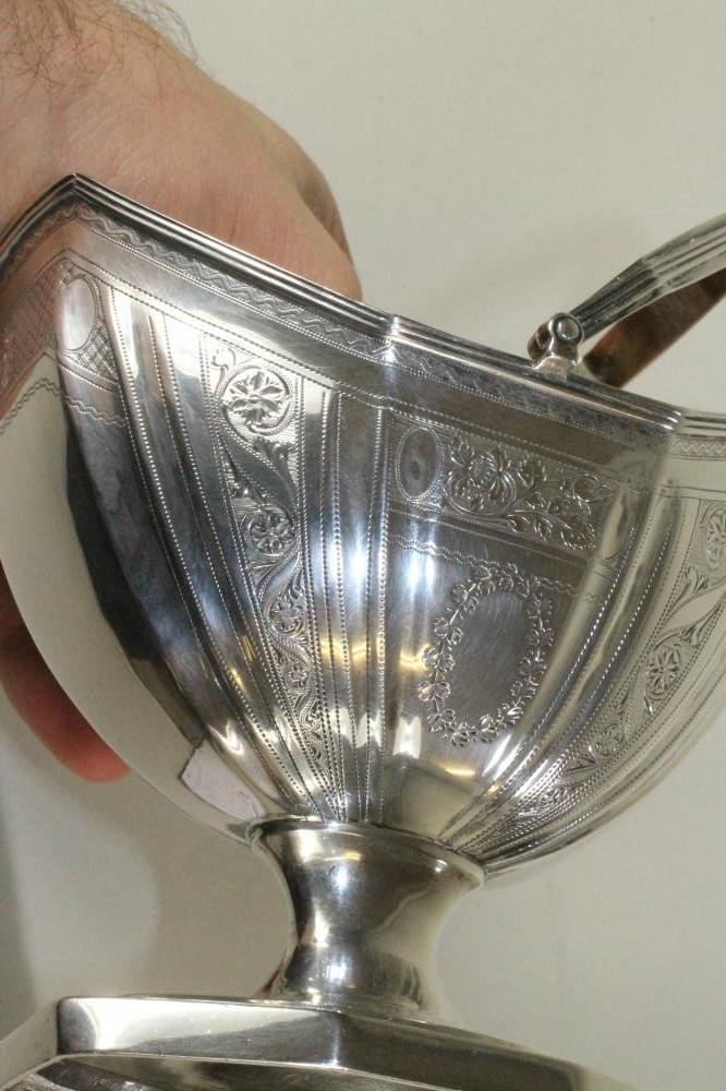 A LATE GEORGE III SILVER SUGAR BASKET Image