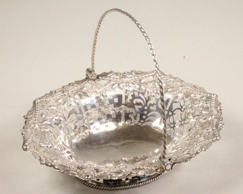 A GEORGE III SILVER SWEETMEAT BASKET Image