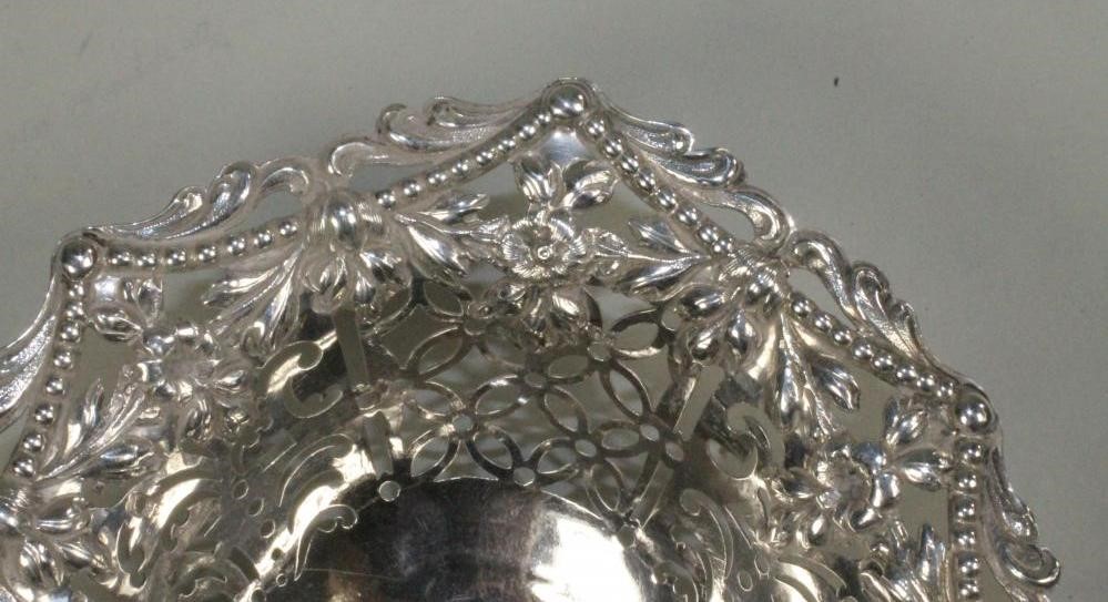 A GEORGE III SILVER SWEETMEAT BASKET Image