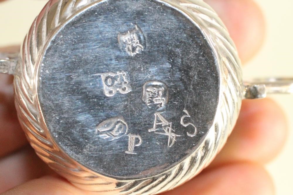 A MATCHED AND COMPOSITE SET OF THREE MINIATURE SILVER PORRINGERS Image