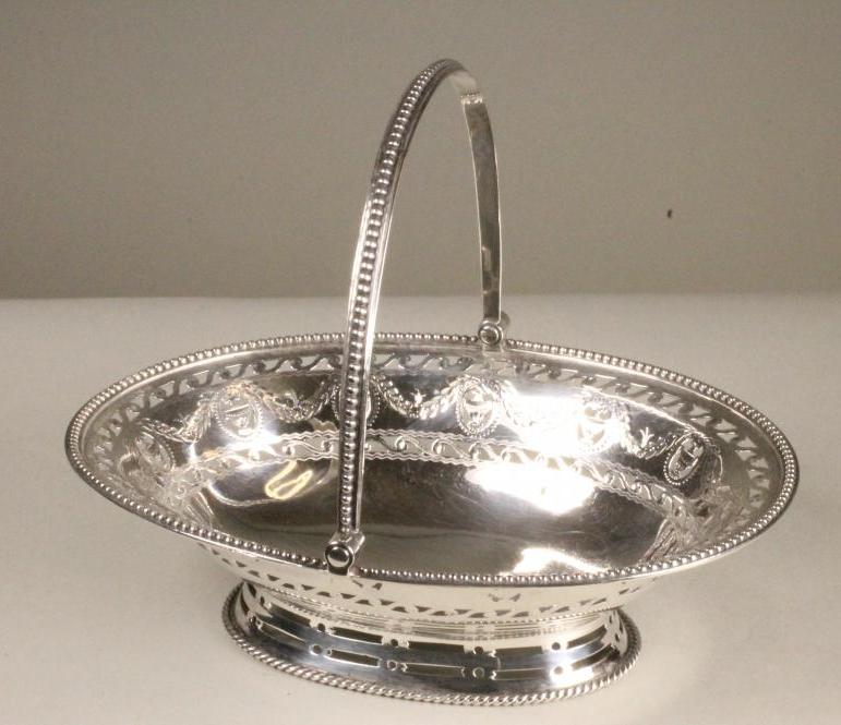 A GEORGE III SILVER BONBON BASKET Image