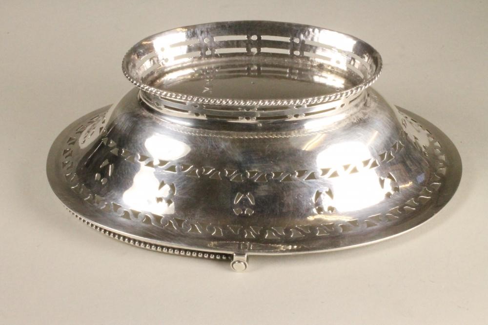 A GEORGE III SILVER BONBON BASKET Image