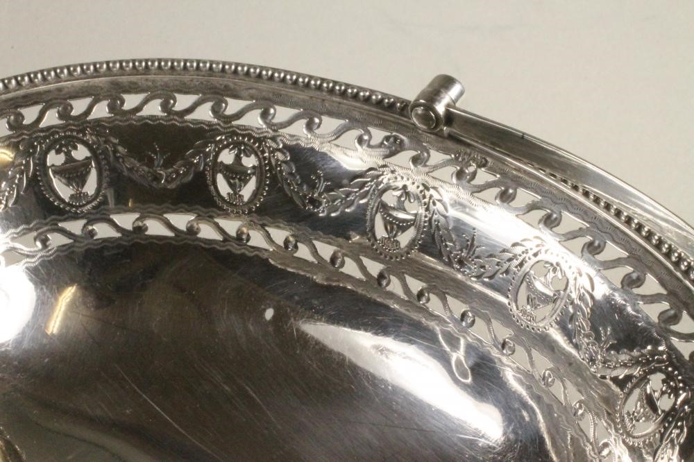 A GEORGE III SILVER BONBON BASKET Image