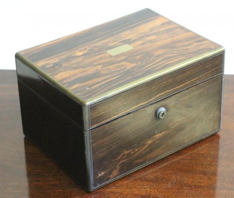 A VICTORIAN COROMANDEL TRAVELLING TOILET CASE of plain oblong form banded with brass and with inlaid Image