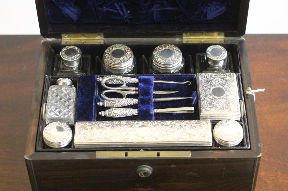 A VICTORIAN COROMANDEL TRAVELLING TOILET CASE of plain oblong form banded with brass and with inlaid Image