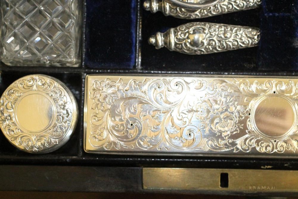 A VICTORIAN COROMANDEL TRAVELLING TOILET CASE of plain oblong form banded with brass and with inlaid Image