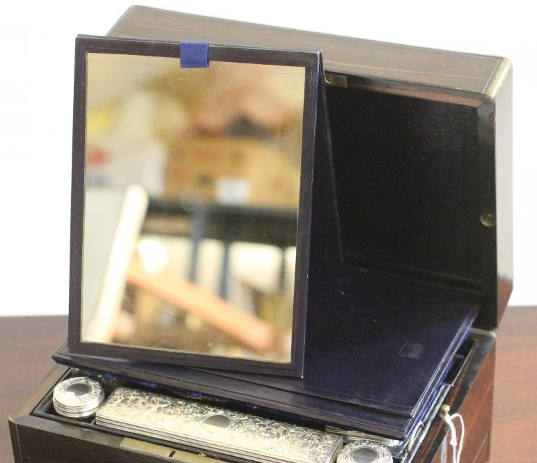 A VICTORIAN COROMANDEL TRAVELLING TOILET CASE of plain oblong form banded with brass and with inlaid Image