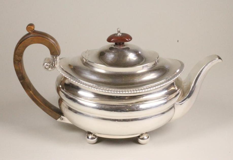 A LATE GEORGE III SILVER TEAPOT Image