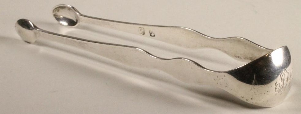 A PAIR OF GEORGE III SCOTTISH PROVINCIAL SILVER SUGAR TONGS Image
