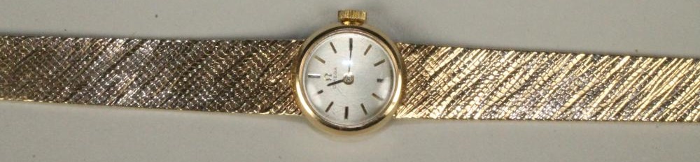 A LADY'S 9CT GOLD OMEGA WRISTWATCH Image