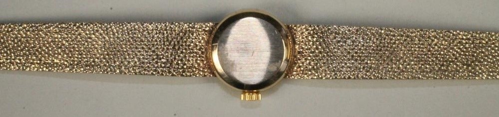 A LADY'S 9CT GOLD OMEGA WRISTWATCH Image