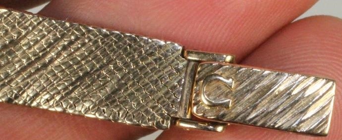 A LADY'S 9CT GOLD OMEGA WRISTWATCH Image