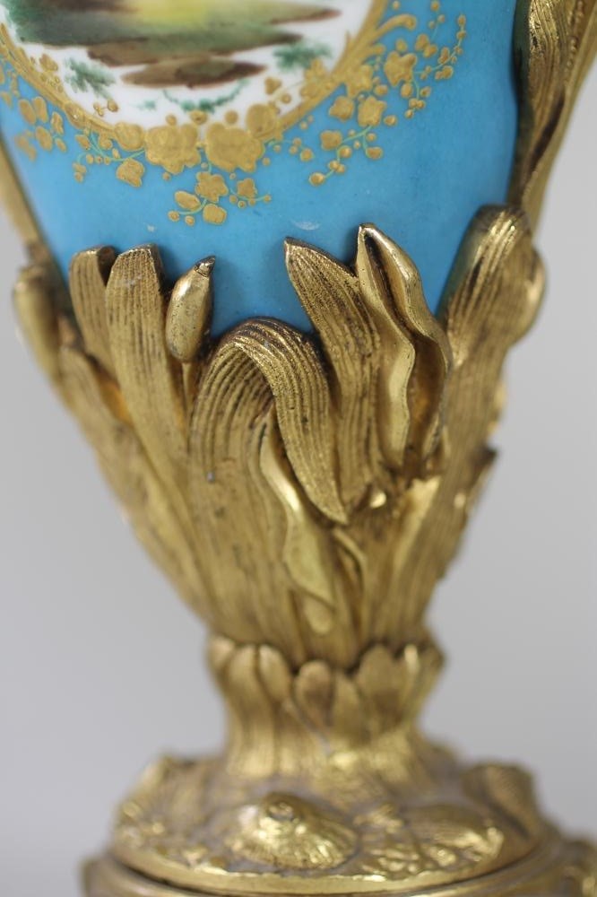 A PAIR OF SEVRES STYLE PORCELAIN GARNITURE EWERS Image