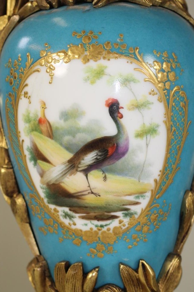 A PAIR OF SEVRES STYLE PORCELAIN GARNITURE EWERS Image