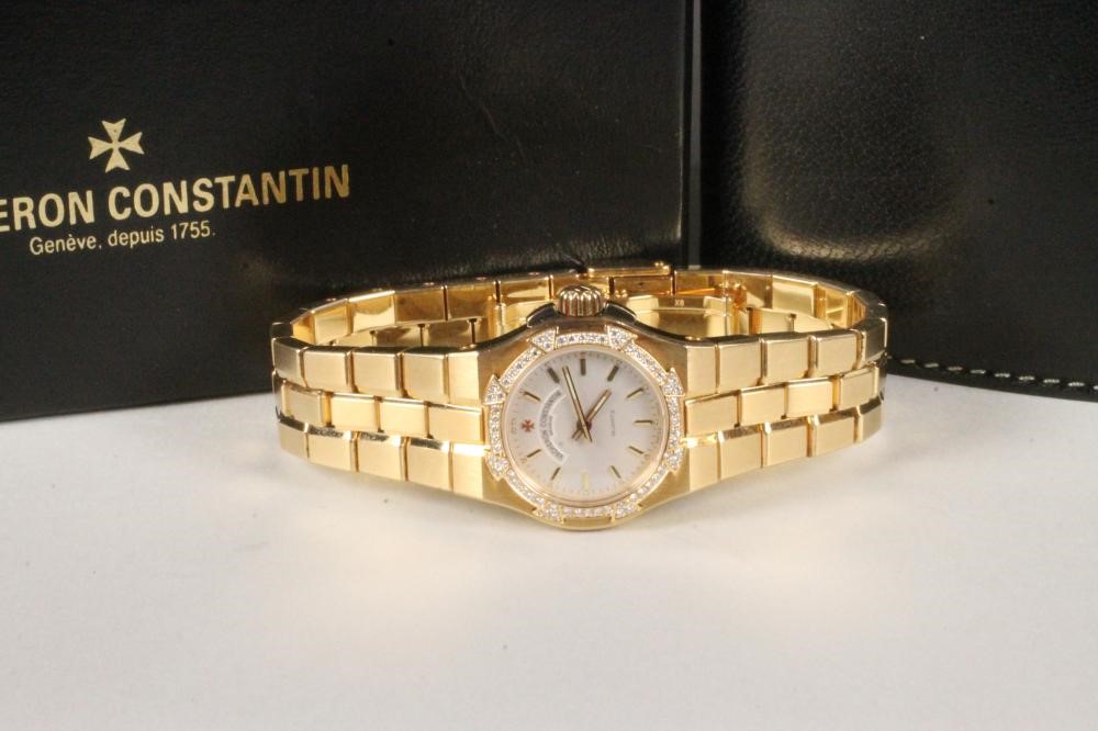 A LADY'S 18CT GOLD AND DIAMOND VACHERON CONSTANTIN "OVERSEAS" WRISTWATCH Image