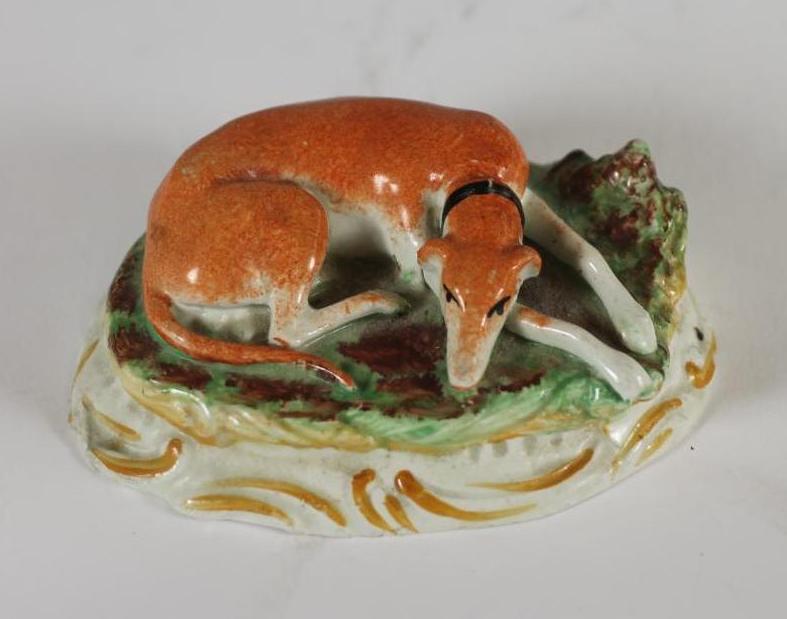 A STAFFORDSHIRE POTTERY GREYHOUND Image