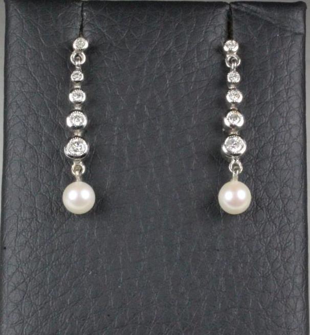 A PAIR OF DIAMOND AND PEARL DROP EARRINGS Image