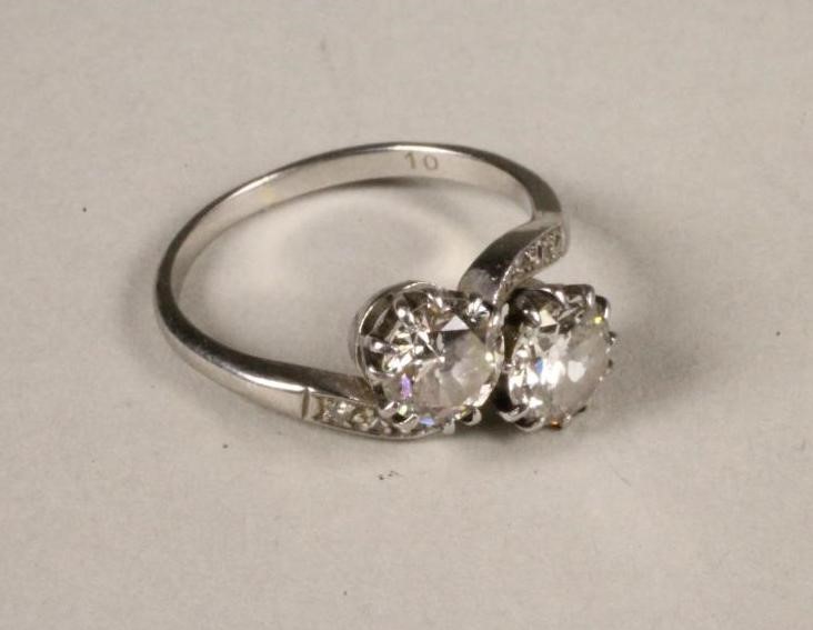 A TWO STONE DIAMOND CROSSOVER RING Image