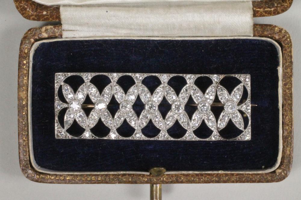 AN ART DECO DIAMOND PANEL BROOCH of plain oblong form with an open grid pave set with numerous Image