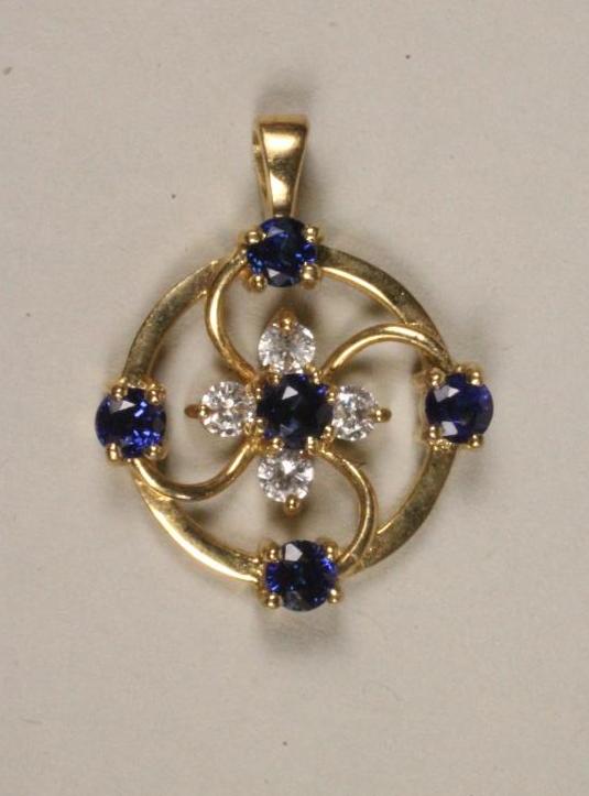 A SAPPHIRE AND DIAMOND SMALL PENDANT Image