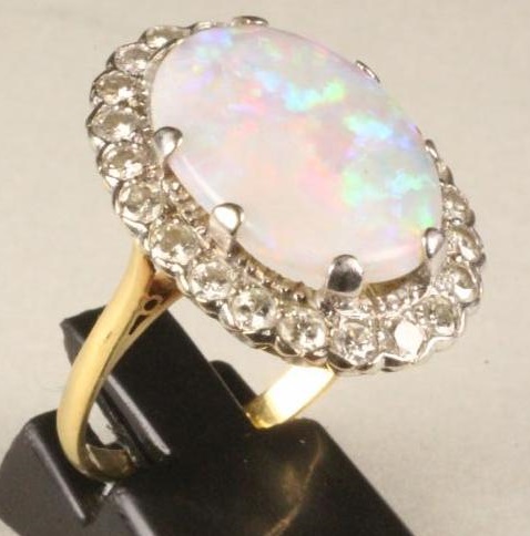 AN OPAL AND DIAMOND DRESS RING Image