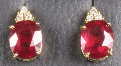 A PAIR OF RUBY EAR STUDS to match the previous lot Image