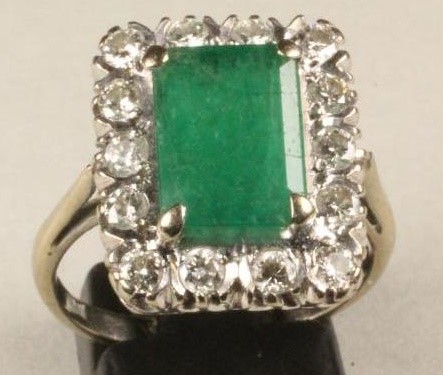 AN EMERALD AND DIAMOND PLAQUE RING Image