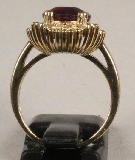 A RUBY AND DIAMOND CLUSTER RING Image