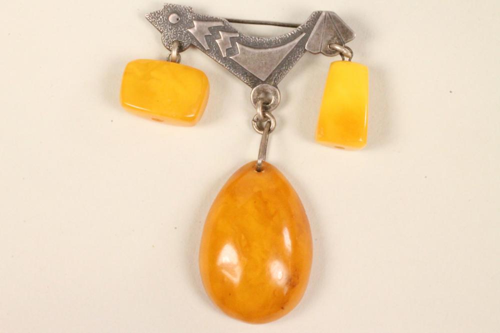 A RUSSIAN SILVER AND AMBER BROOCH Image
