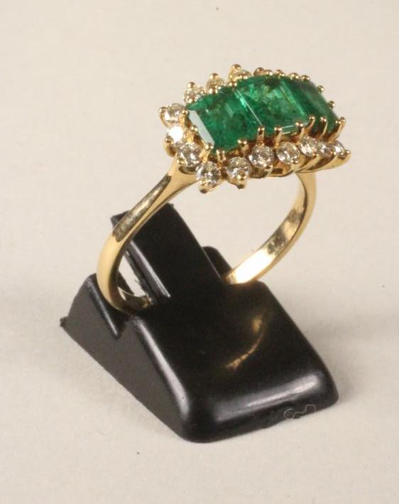 AN EMERALD AND DIAMOND DRESS RING Image
