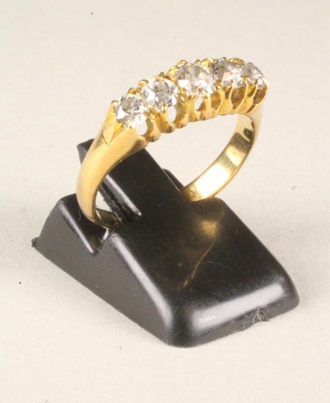 A FIVE STONE DIAMOND RING Image