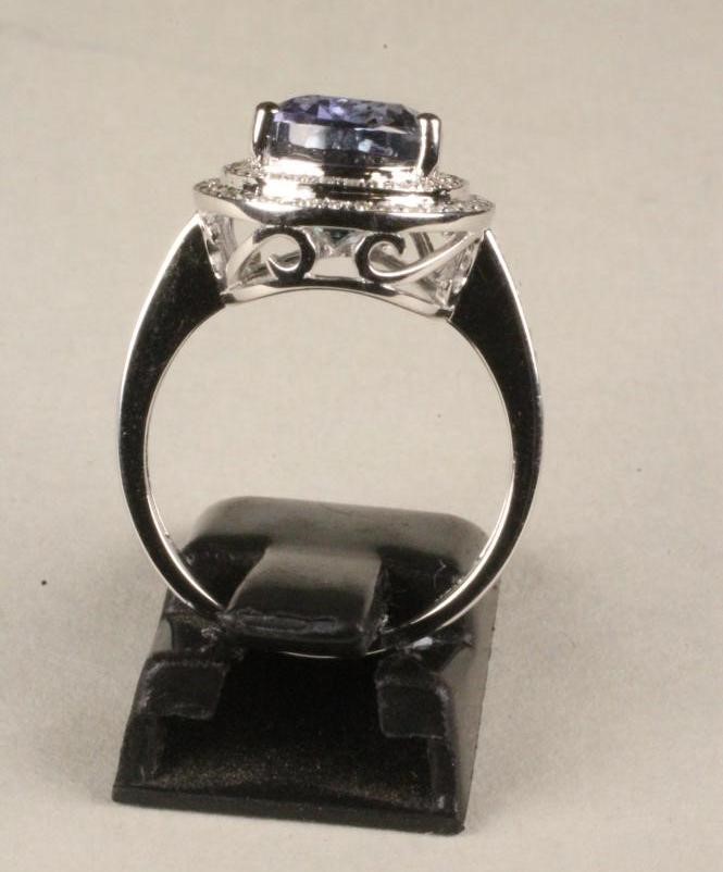 A TANZANITE AND DIAMOND COCKTAIL RING Image