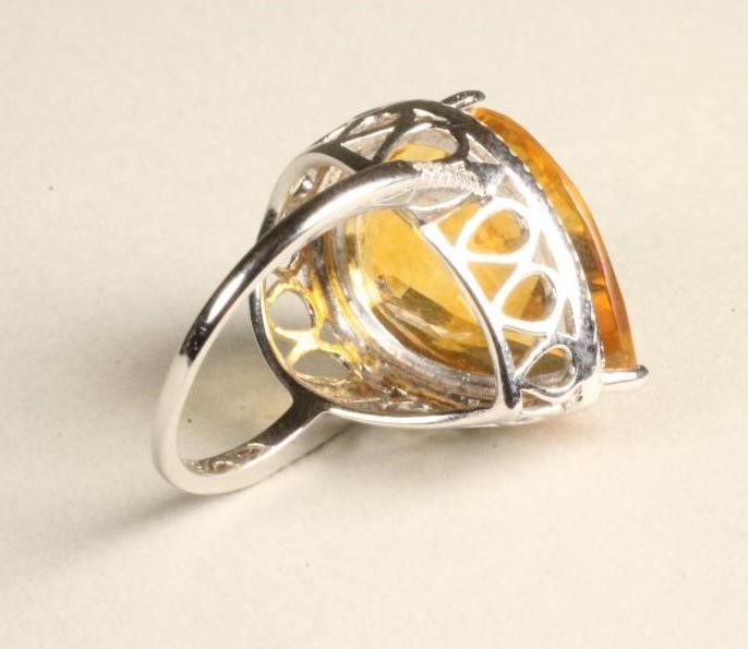 A CITRINE AND DIAMOND COCKTAIL RING Image