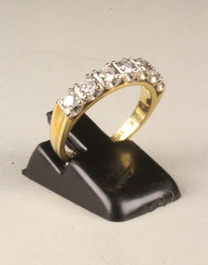 A SEVEN STONE DIAMOND HALF HOOP ETERNITY RING Image