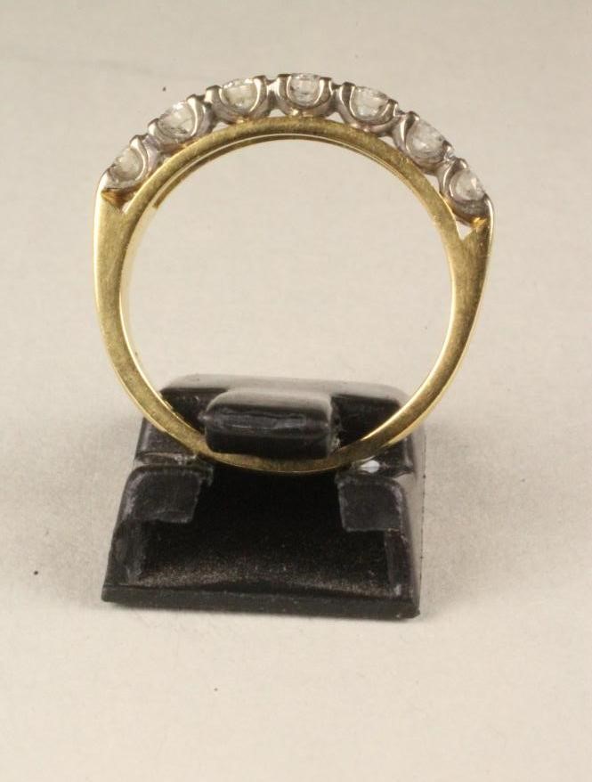 A SEVEN STONE DIAMOND HALF HOOP ETERNITY RING Image
