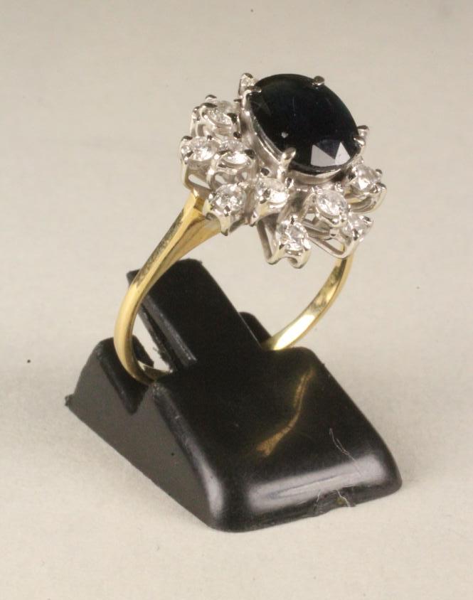 A SAPPHIRE AND DIAMOND OPEN CLUSTER RING Image