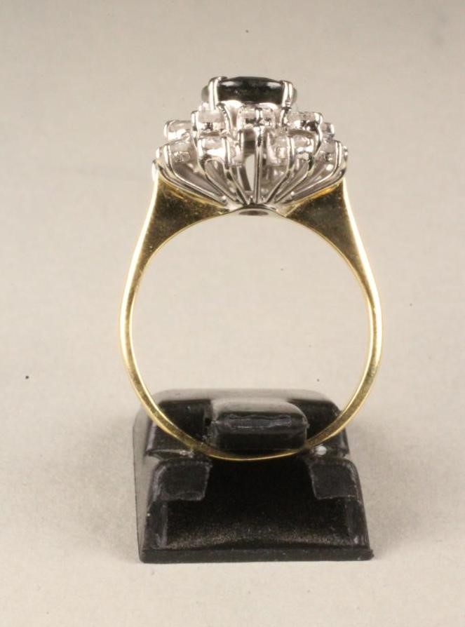 A SAPPHIRE AND DIAMOND OPEN CLUSTER RING Image