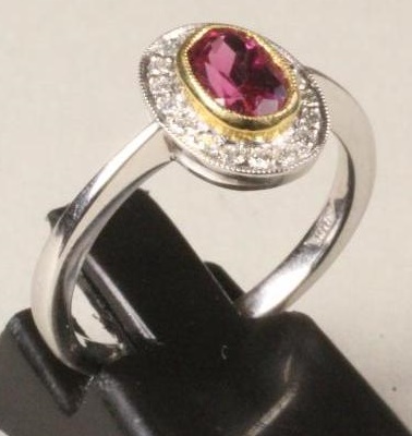 A RUBELITE AND DIAMOND CLUSTER RING Image