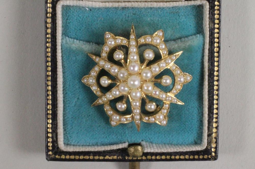 AN EDWARDIAN SEED PEARL STAR BROOCH Image