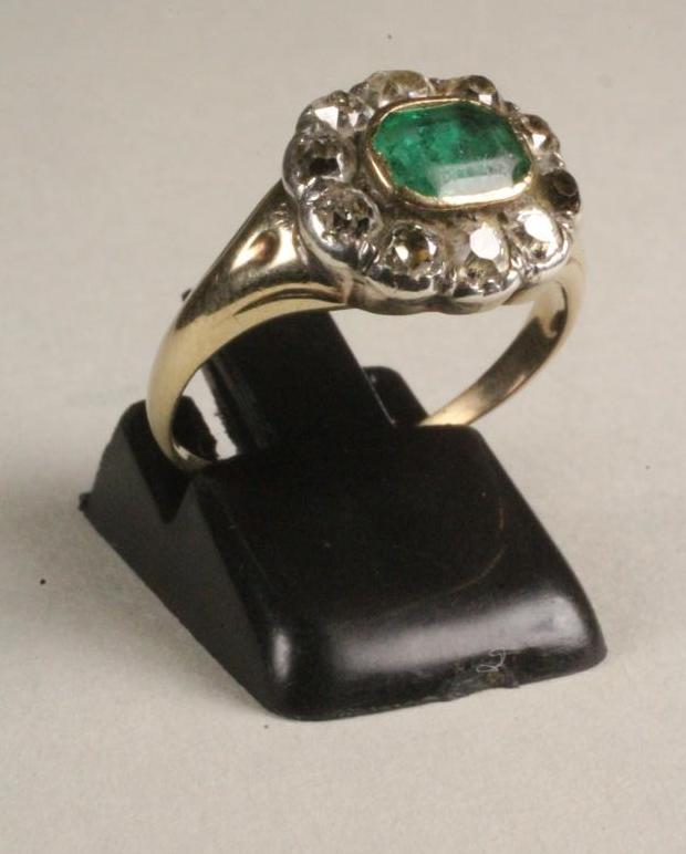 A 19TH CENTURY EMERALD AND DIAMOND CLUSTER RING Image