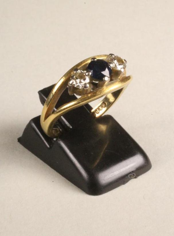 A SAPPHIRE AND DIAMOND THREE STONE RING Image